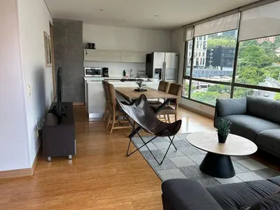 a living room with a couch and a table at Amazing 3 bedroom near Provenza- El Poblado 701 in Medellín