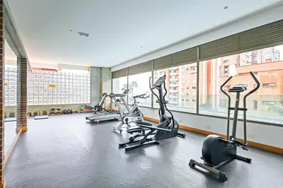 a gym with treadmills and ellipticals in a building at Amazing 3 bedroom near Provenza- El Poblado 701 in Medellín