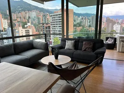 a living room with a couch and a table at Amazing 3 bedroom near Provenza- El Poblado 701 in Medellín