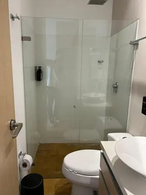a bathroom with a shower and a toilet and a sink at Amazing 3 bedroom near Provenza- El Poblado 701 in Medellín