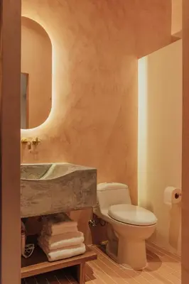 a bathroom with a sink and a toilet and a mirror at New designed Loft in Laureles with AC and WiFi in Medellín