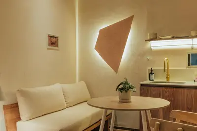a living room with a couch and a table at New designed Loft in Laureles with AC and WiFi in Medellín