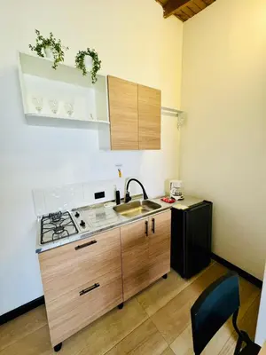 a kitchen with a sink and a stove at Lucia Metro House in Medellín
