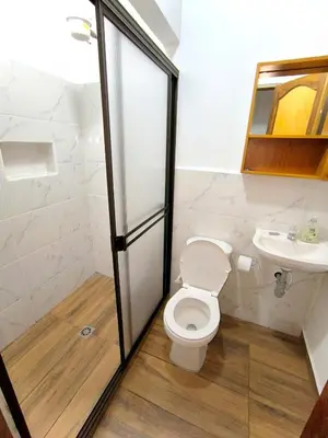 a bathroom with a toilet and a sink at aparta hotel La Gruta Jericó, apartamento con balcón in Jericó