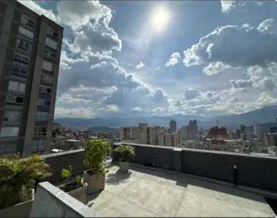 a view of a city skyline from a balcony at Loft hermoso y céntrico 1109 in Medellín