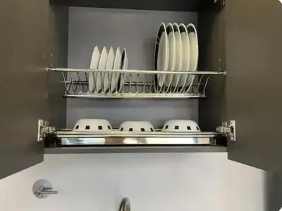 a kitchen shelf with plates and bowls on it at Loft hermoso y céntrico 1109 in Medellín