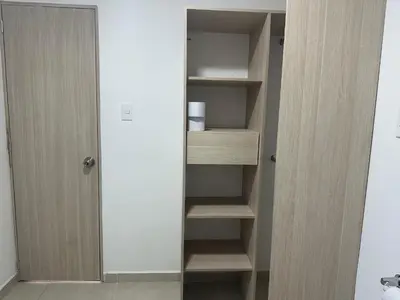 a closet with wooden shelves in a room at loft dreams 7006 in Medellín