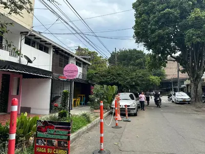 a street with cars parked on the side of the road at loft dreams 7006 in Medellín