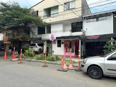 a street with orange cones in front of a building at loft dreams 7006 in Medellín