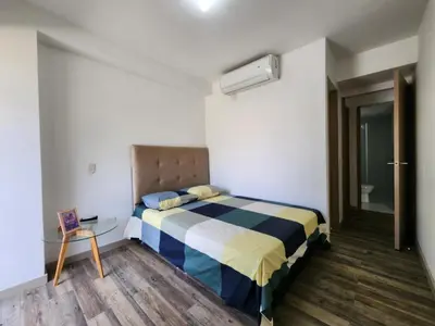 a bedroom with a bed and a glass table at Family Resort Santa Fe De Antioquia - Santa Fe de Antioquia in Santa Fe de Antioquia
