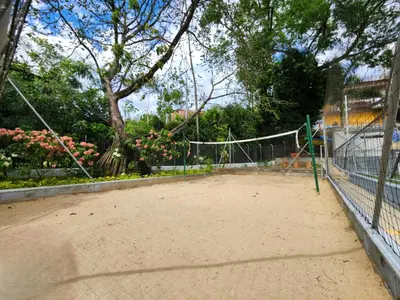a tennis court with a net on top of it at Family Resort Santa Fe De Antioquia - Santa Fe de Antioquia in Santa Fe de Antioquia