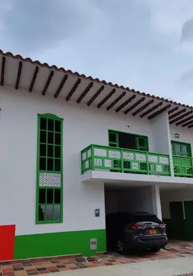 a car parked in the garage of a house at La Casa del Colibrí in Jericó