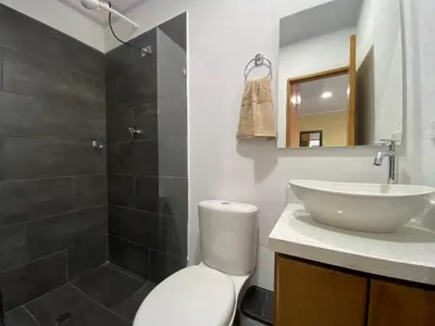 a bathroom with a toilet and a sink and a shower at Horus Loft - Con Terraza en todo el Centro in Carmen de Viboral