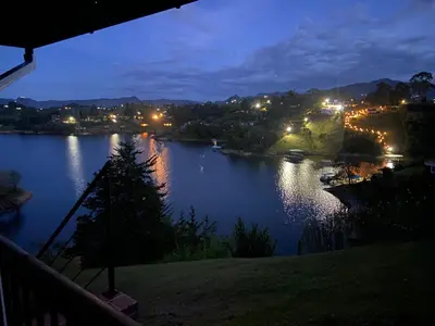 a view of a river at night at Loge Cabaña peñol-Guatape in El Peñol