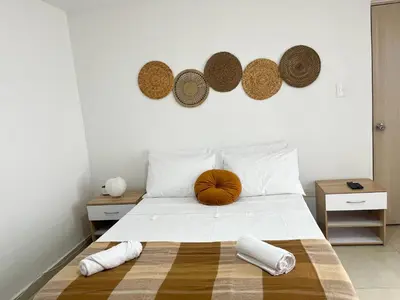 a bedroom with a bed with a pumpkin on it at Loft dreams 7005 in Medellín