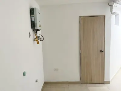 a room with a door and a tv on the wall at Loft dreams 7005 in Medellín