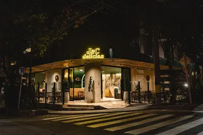 a store with a sign on the front of it at night at Sloh Hotel & Bar Manila Medellin in Medellín