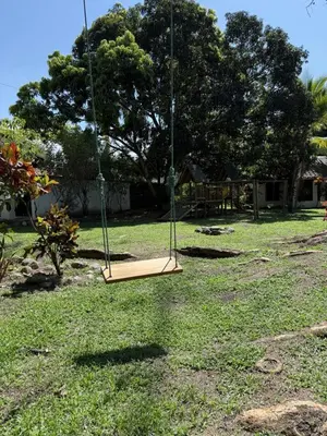 a swing seat in a yard with a grass yard at Finca en Sopetran in Sopetran