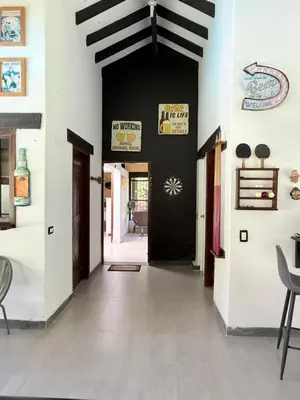 a hallway of a house with a black door at Finca en Sopetran in Sopetran