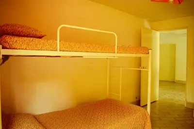 a bedroom with two bunk beds in a room at Villa Privada con entrada y salida 100 por ciento flexible in La Florida