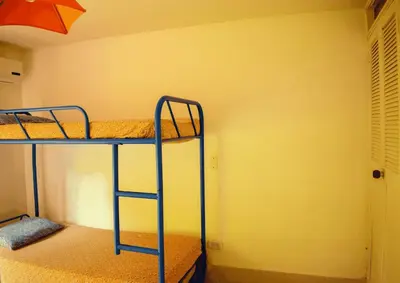 a bunk bed room with two bunk beds in a room at Villa Privada con entrada y salida 100 por ciento flexible in La Florida