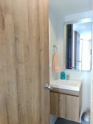 a bathroom with a sink and a mirror at Brand New Apartment Manizales in Manizales