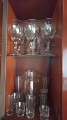 a bunch of wine glasses and cups on shelves at EpicBK Casa Campestre en San Pedro Antioquia in Zatra Tobón
