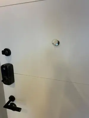 a white wall with two handles and a drawer at Luxury Apartment Jacuzzi Air Conditioning Fireplace and King Bed in Medellín