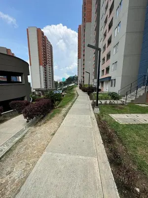 an empty sidewalk in a city with tall buildings at Luxury Apartment Jacuzzi Air Conditioning Fireplace and King Bed in Medellín