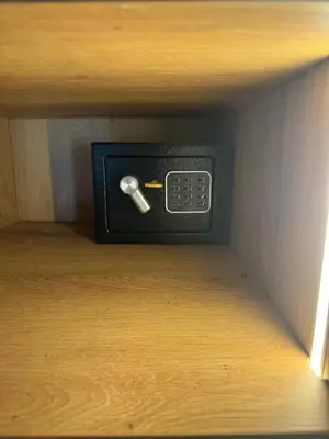a box with a remote control on a shelf at Luxury Apartment Jacuzzi Air Conditioning Fireplace and King Bed in Medellín