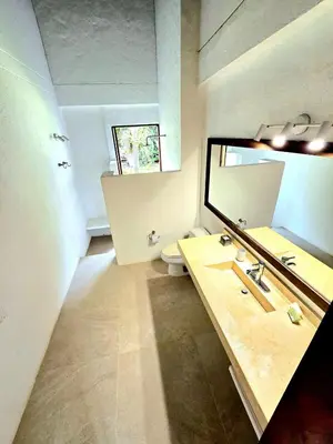 a bathroom with a sink and a large mirror at Casa finca Pool & Jacuzzi, Tropical Oasis in Jericó