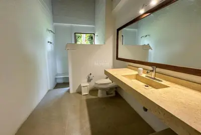 a bathroom with a sink and a toilet and a mirror at Casa finca Pool & Jacuzzi, Tropical Oasis in Jericó