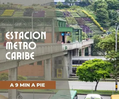 a sign for a station metro carride on a bridge at Casa de las Flores en Medellín in Medellín