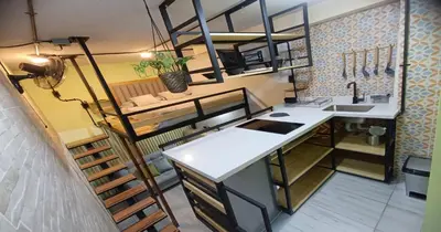 a kitchen with a counter and a sink in a room at Zen Hausinn Cozy Studio - Poblado Medellin in Medellín
