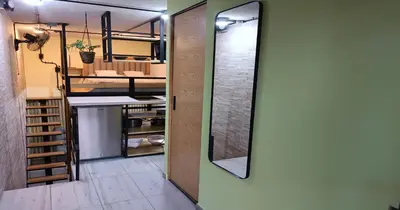 a room with a mirror on the wall and a closet at Zen Hausinn Cozy Studio - Poblado Medellin in Medellín