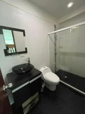 a bathroom with a toilet and a sink and a shower at Paraíso in San Jerónimo