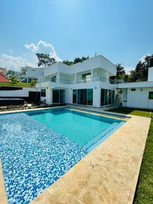 a house with a swimming pool in front of it at Paraíso in San Jerónimo