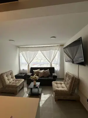 a living room with a couch and two chairs at Apartamento familiar y agradable in Manizales