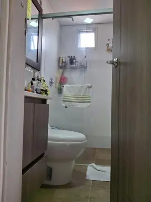 a bathroom with a white toilet and a shower at RentalsOP AN09 Apartamento en Laureles el barrio mas cool del mundo, moderno, con balcon y excelente vista in Medellín