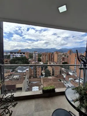 a view of a city from a balcony at RentalsOP AN09 Apartamento en Laureles el barrio mas cool del mundo, moderno, con balcon y excelente vista in Medellín