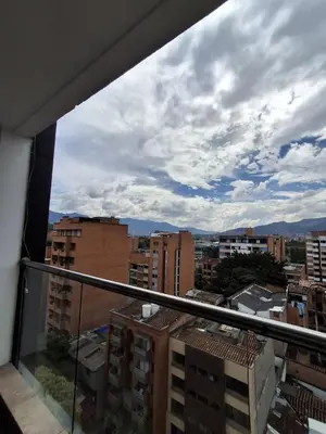 a view of a city from a balcony at RentalsOP AN09 Apartamento en Laureles el barrio mas cool del mundo, moderno, con balcon y excelente vista in Medellín