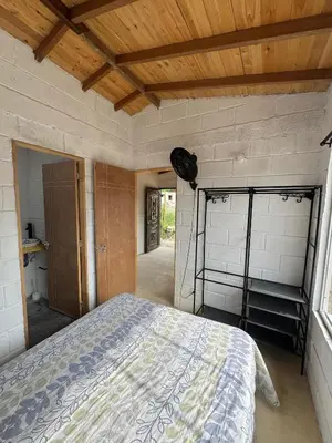 a bedroom with a bed and a wooden ceiling at Mariposa 1 in Sopetran