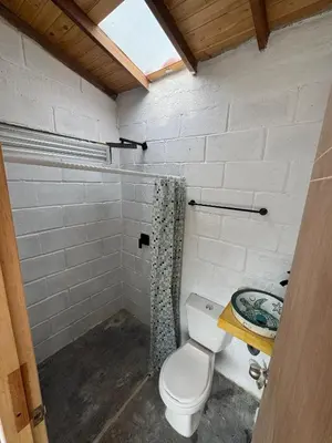 a bathroom with a toilet and a sink at Mariposa 1 in Sopetran