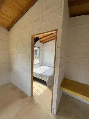 a room with a bed in a brick wall at Mariposa 1 in Sopetran