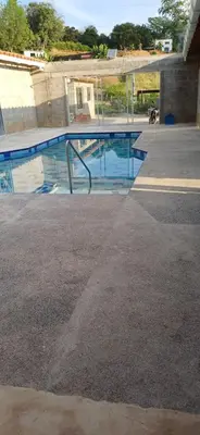 a swimming pool in the middle of a building at Mariposa 1 in Sopetran