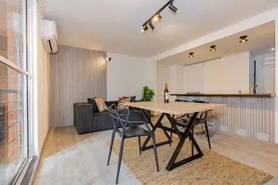 a living room with a table and a couch at Edificio Casa Roma by Host Medellin in Medellín
