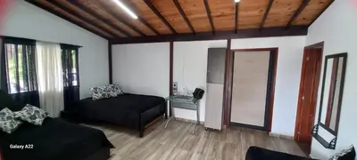 a room with a bed and a desk in it at Cabañas Ecologe BLESS in Chiquinquirá