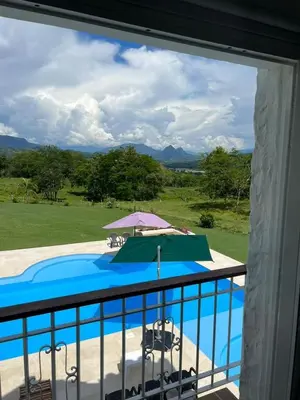 a view of a swimming pool from a balcony at Disponible 4 enero 2026 hasta reyes-PASEOS GRANDES!!!-14 PAX-Hacienda Manantiales Paraíso Natural in Fredonia