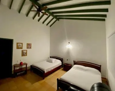 a bedroom with two beds in a room at Disponible 4 enero 2026 hasta reyes-PASEOS GRANDES!!!-14 PAX-Hacienda Manantiales Paraíso Natural in Fredonia