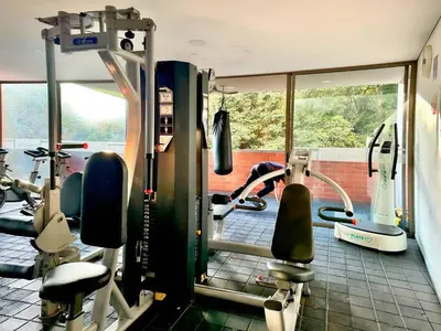 a gym with a person working out in the gym at 3BR AC Top Location Views El Poblado in Medellín